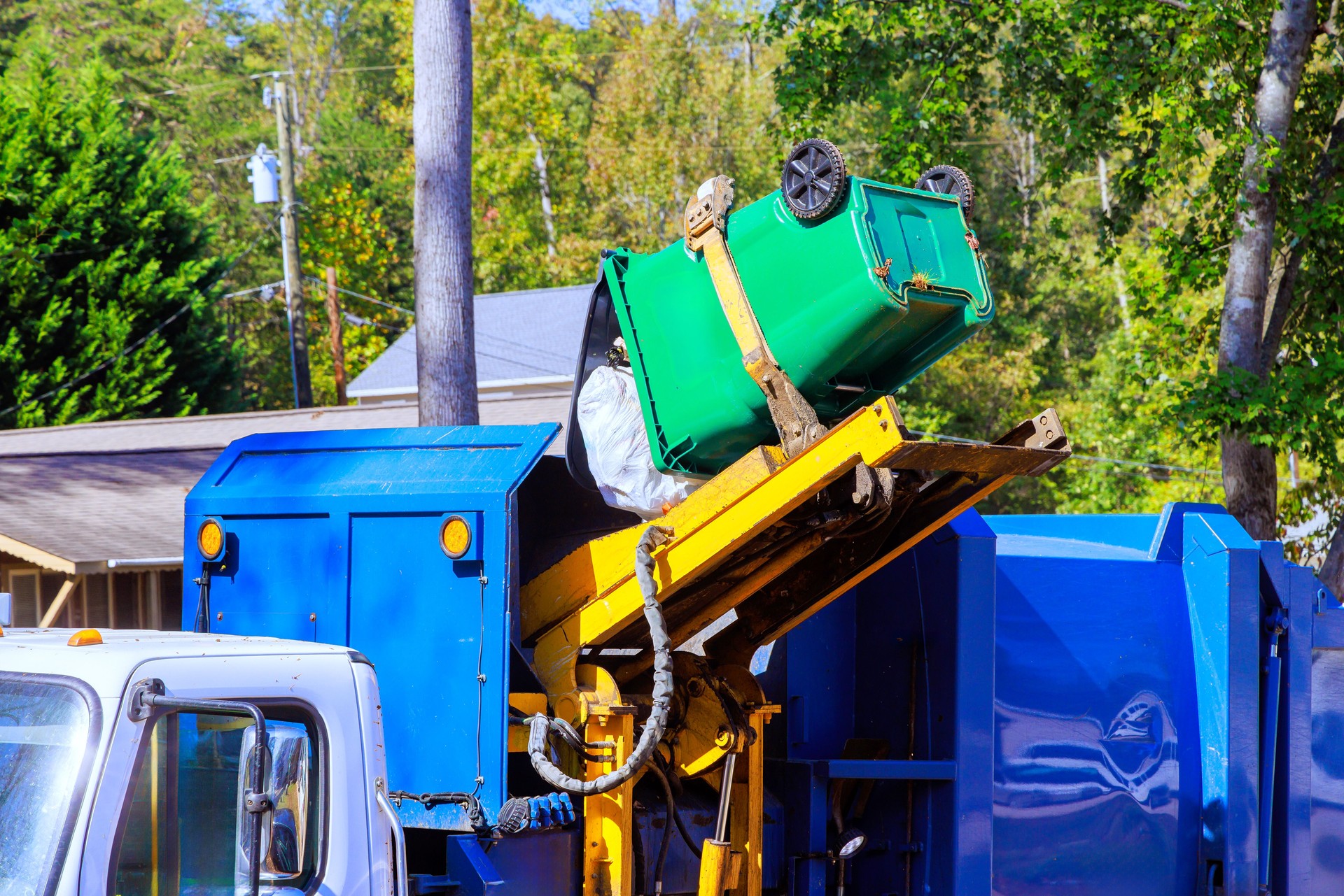 Removal of garbage by municipal cleaning services by loading mixed household waste into a garbage trucks